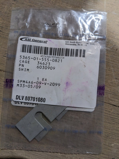 AM General 6030909 Dovetail Shim - NSN 5365-01-555-0821 - inventory label