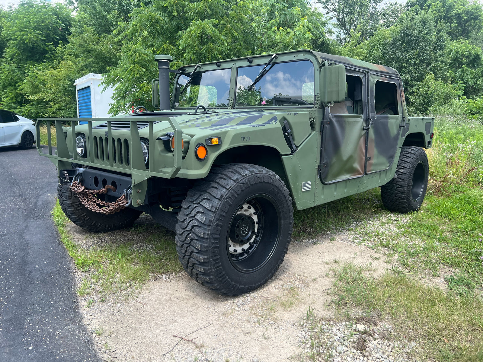 Rebuilt olive green HMMWV, three-quarter front left